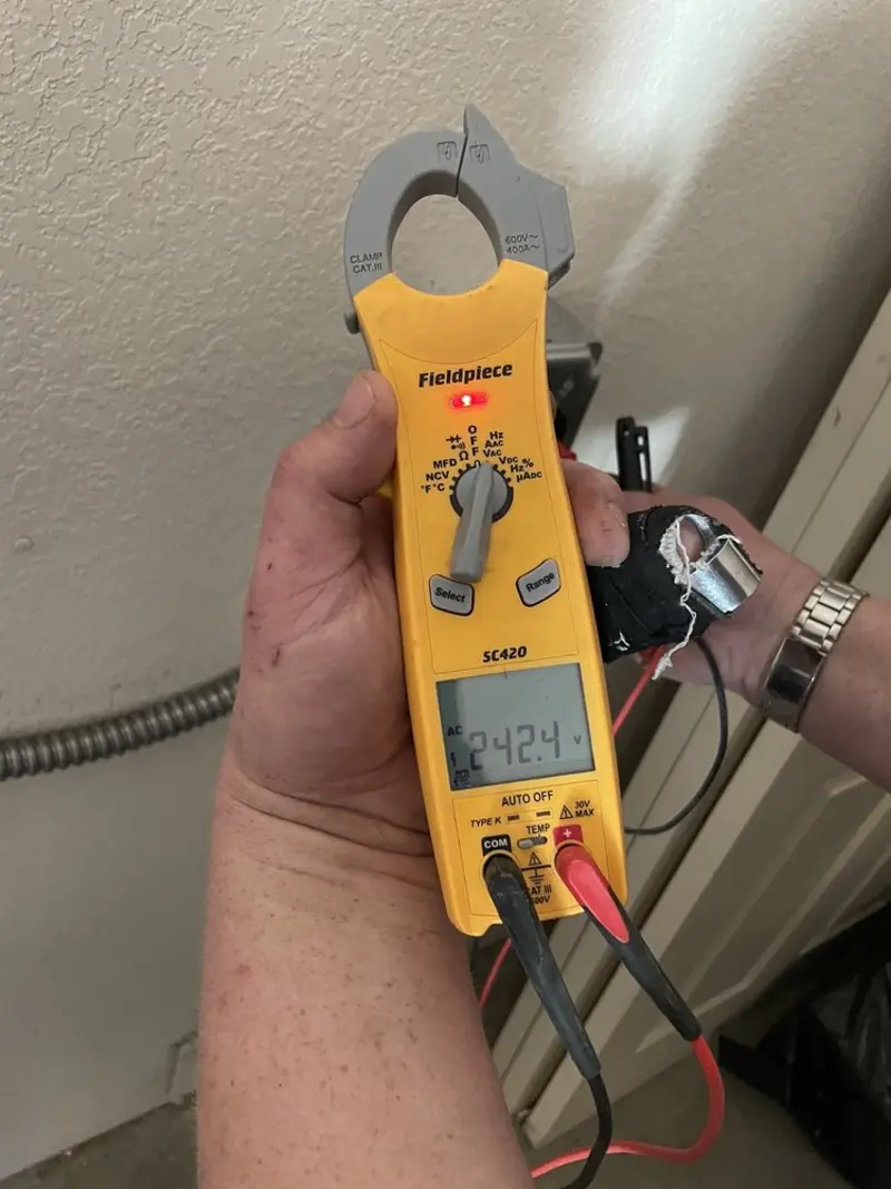 Voltage testing with clamp meter during Ceiling Fan Installation in Falls Church